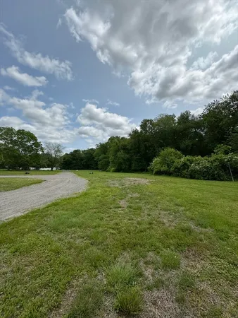 a view of a lake with houses in the back