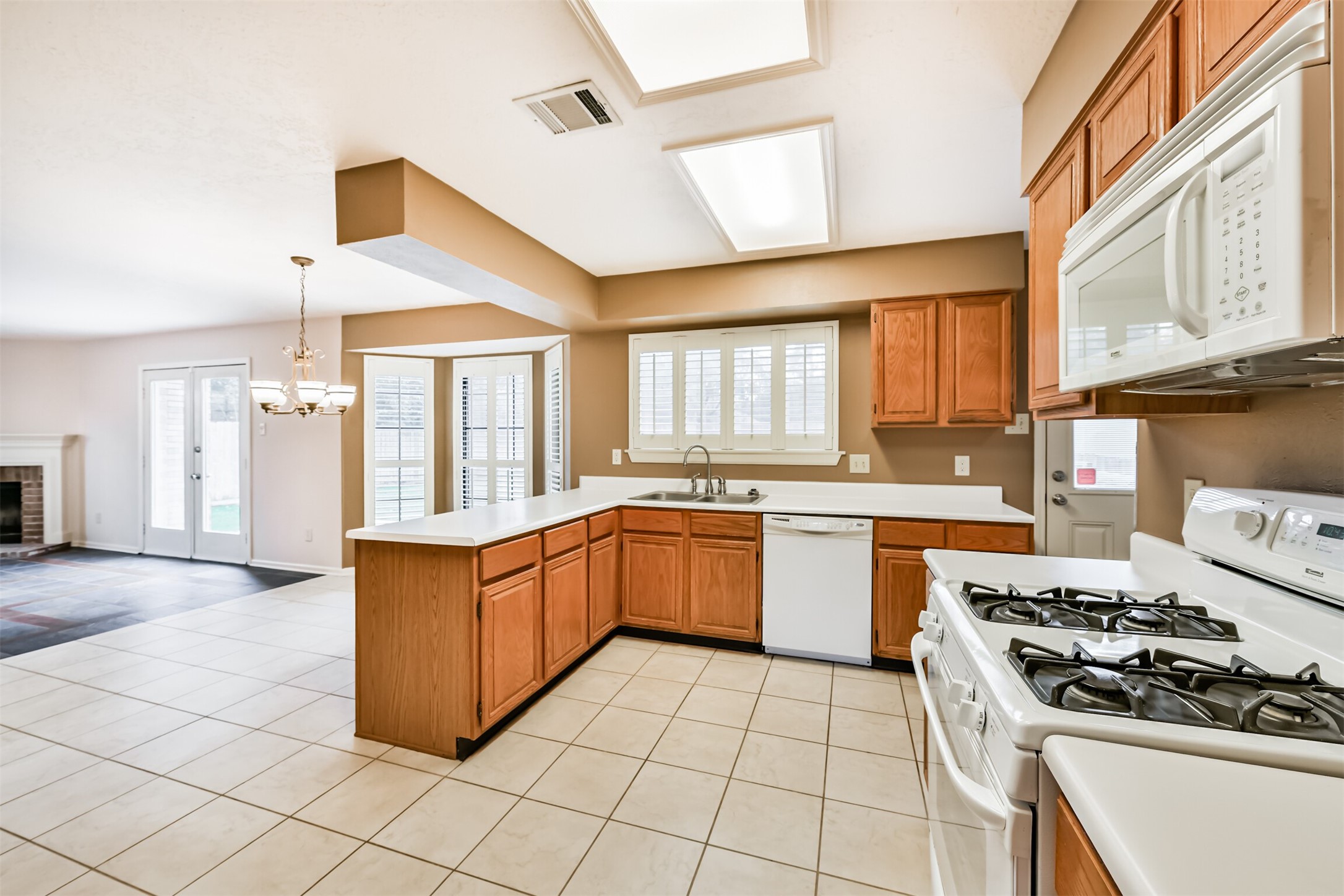 14506 Harvest Ridge Road Houston, TX 77062 - Photo 18 of 39 a kitchen with stainless steel appliances granite countertop a stove a sink and a refrigerator
