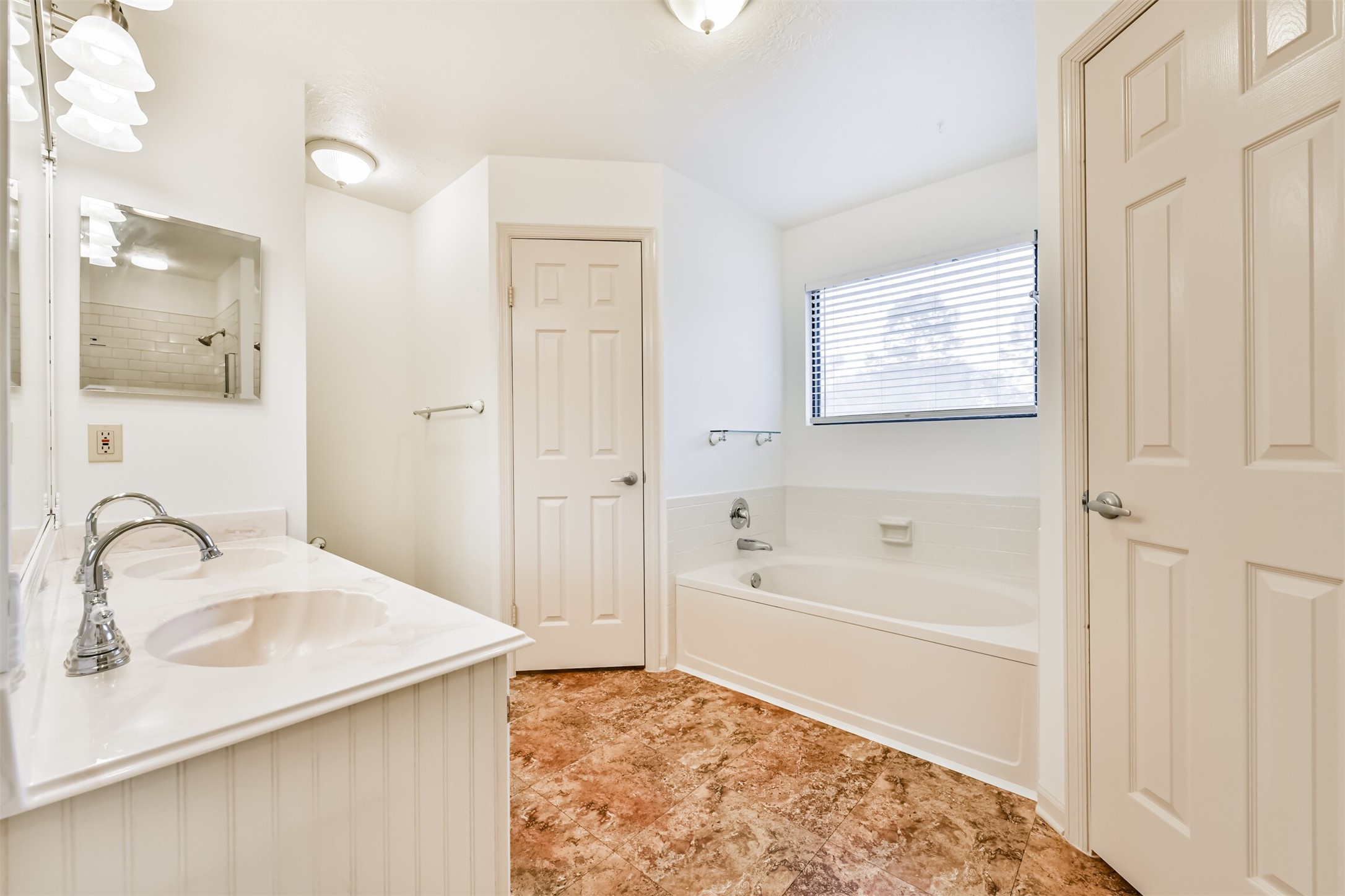 14506 Harvest Ridge Road Houston, TX 77062 - Photo 23 of 39 a bathroom with a sink a bathtub and a shower
