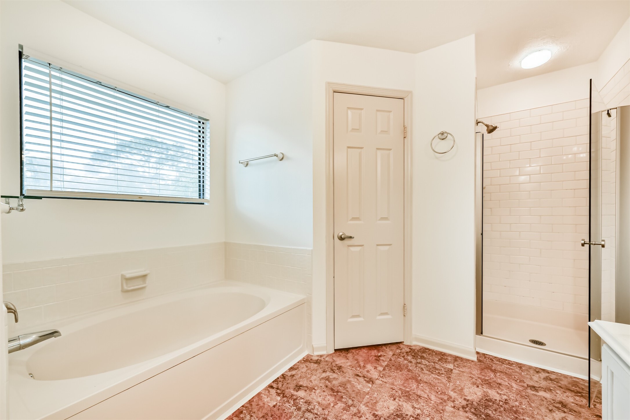 14506 Harvest Ridge Road Houston, TX 77062 - Photo 25 of 39 a bathroom with a bathtub and shower