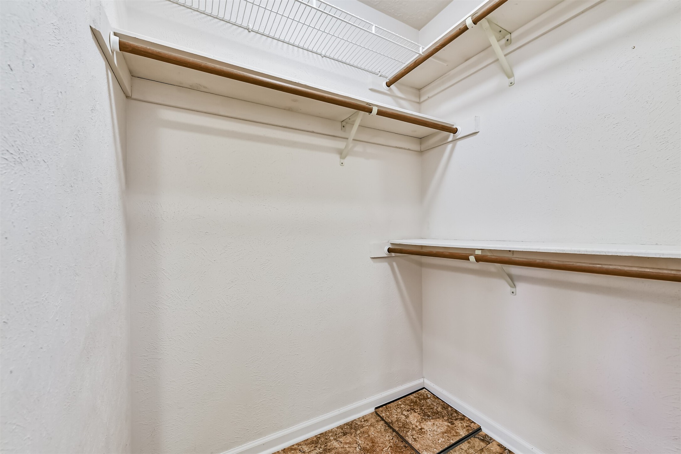 14506 Harvest Ridge Road Houston, TX 77062 - Photo 27 of 39 a view of a room with racks on the wall