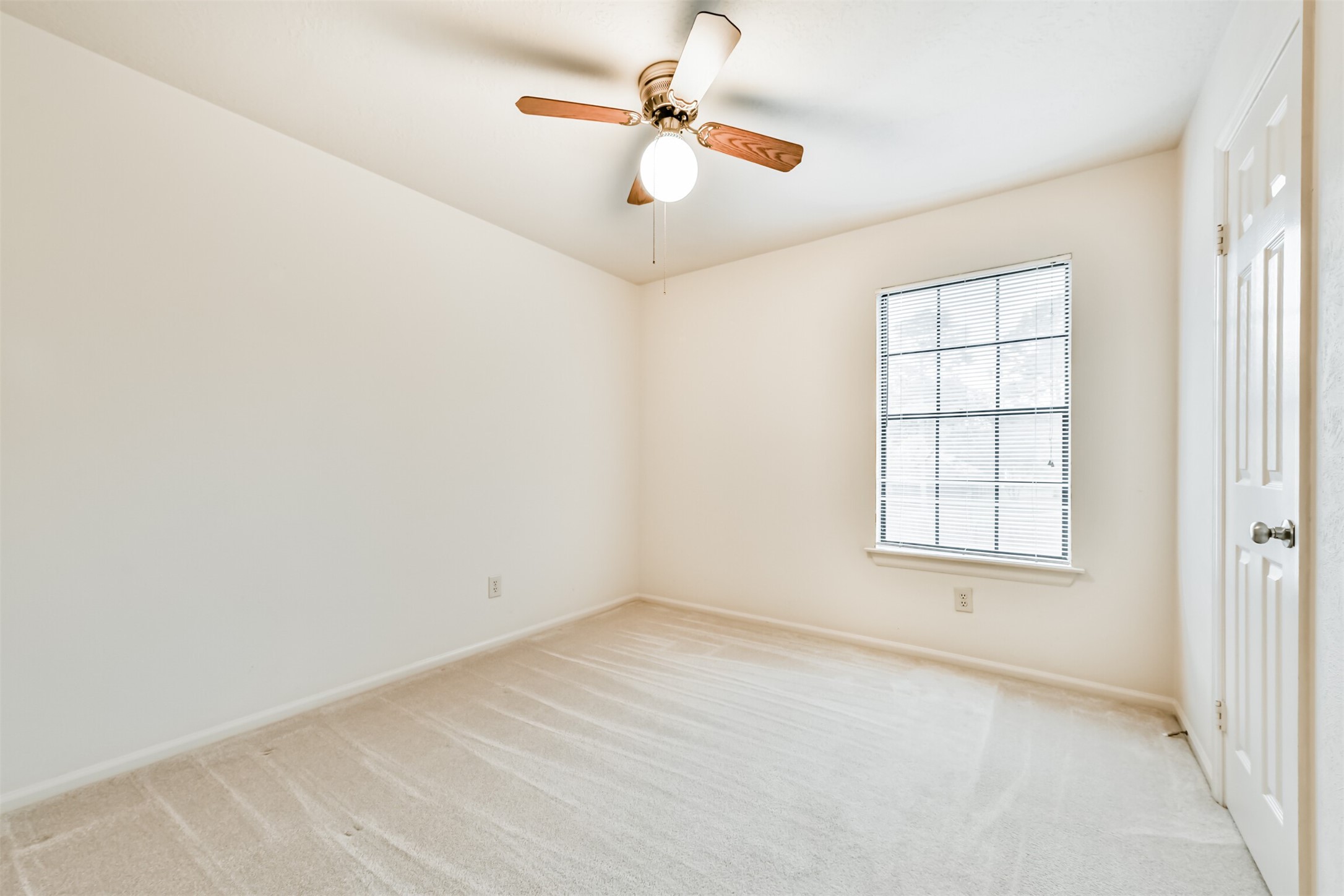 14506 Harvest Ridge Road Houston, TX 77062 - Photo 30 of 39 an empty room with windows and fan