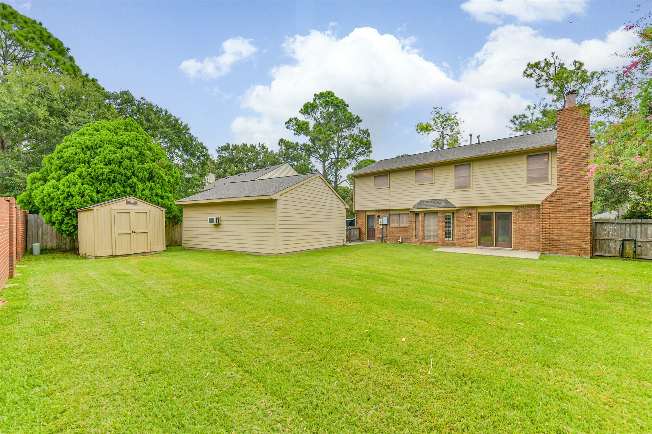 14506 Harvest Ridge Road Houston, TX 77062 - Photo 3 of 39 a view of a house with a backyard and a tree