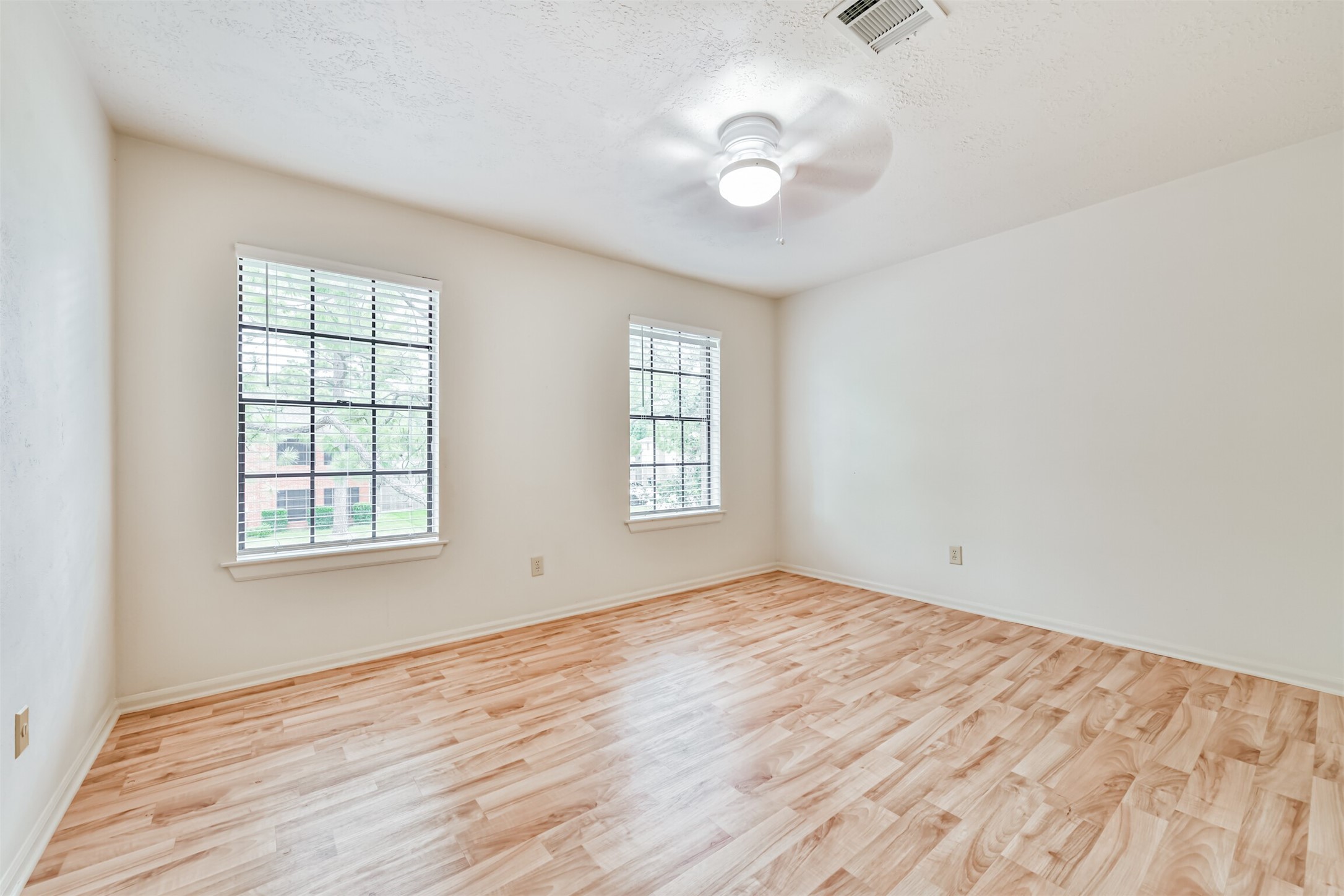 14506 Harvest Ridge Road Houston, TX 77062 - Photo 32 of 39 wooden floor in an empty room with a window