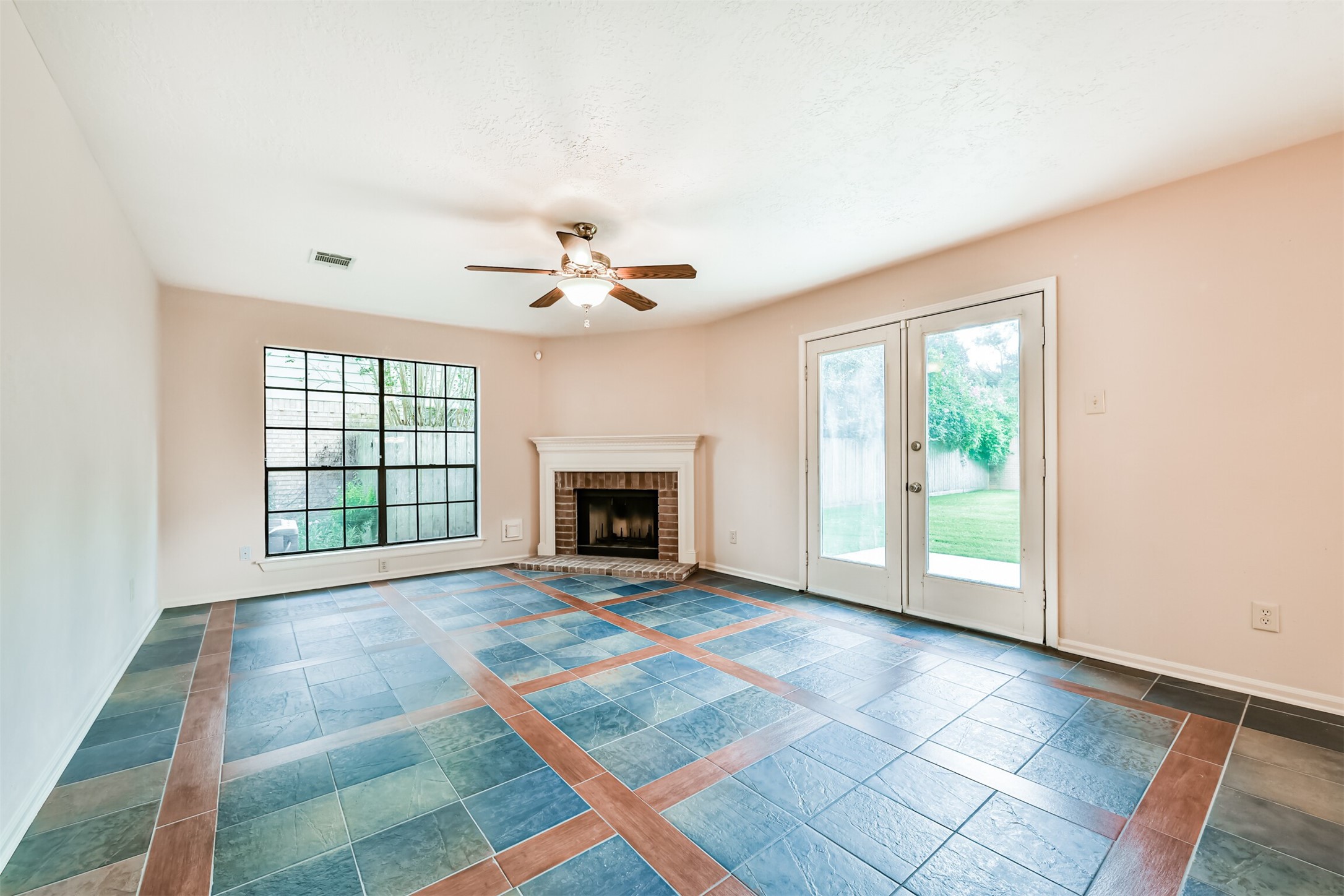 14506 Harvest Ridge Road Houston, TX 77062 - Photo 4 of 39 a view of an empty room with a fireplace and a window