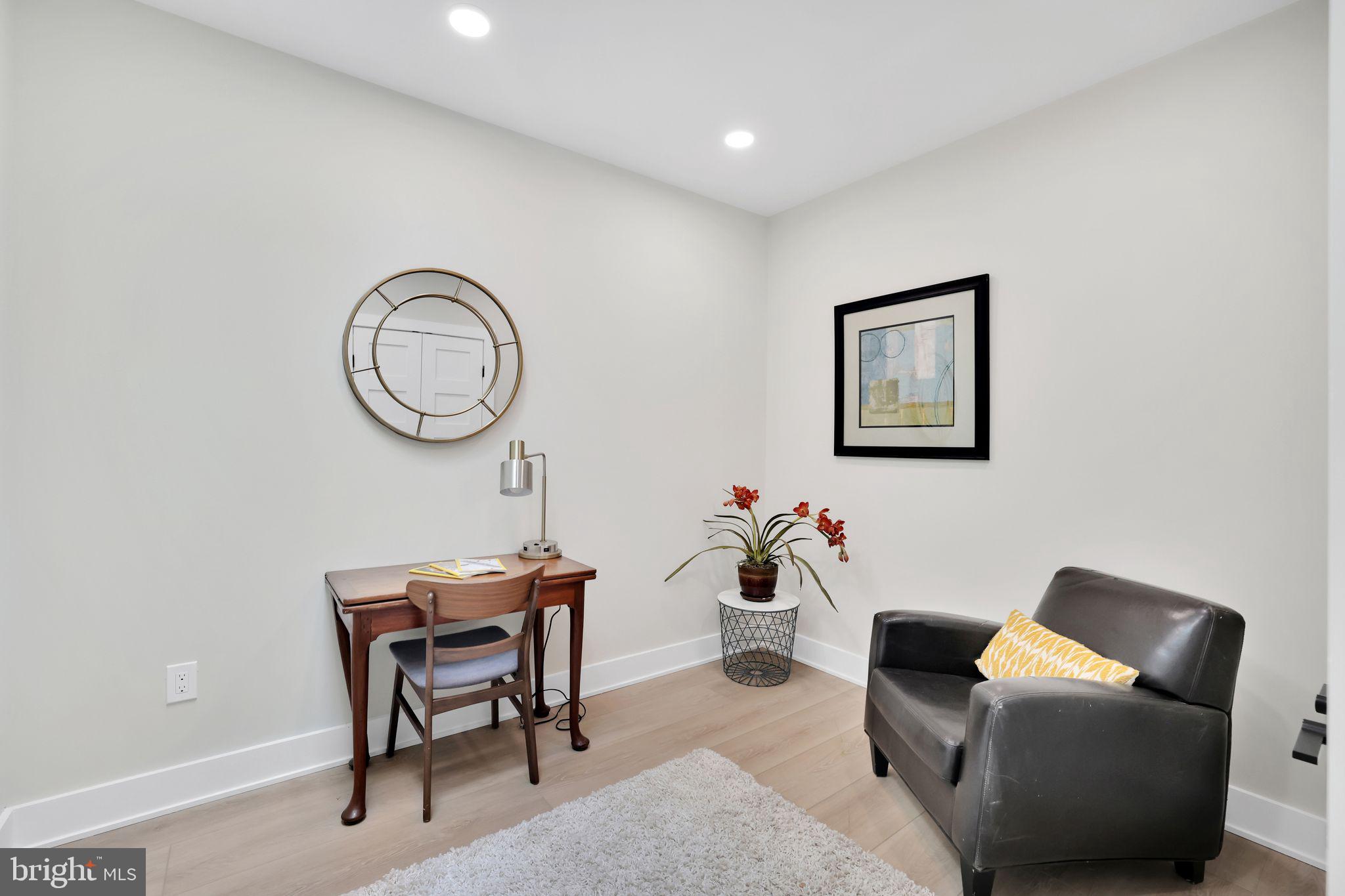 4019 9th Street Northeast, Unit 2 Washington, DC 20017 - Photo 14 of 27 a living room with furniture a wall clock and a window