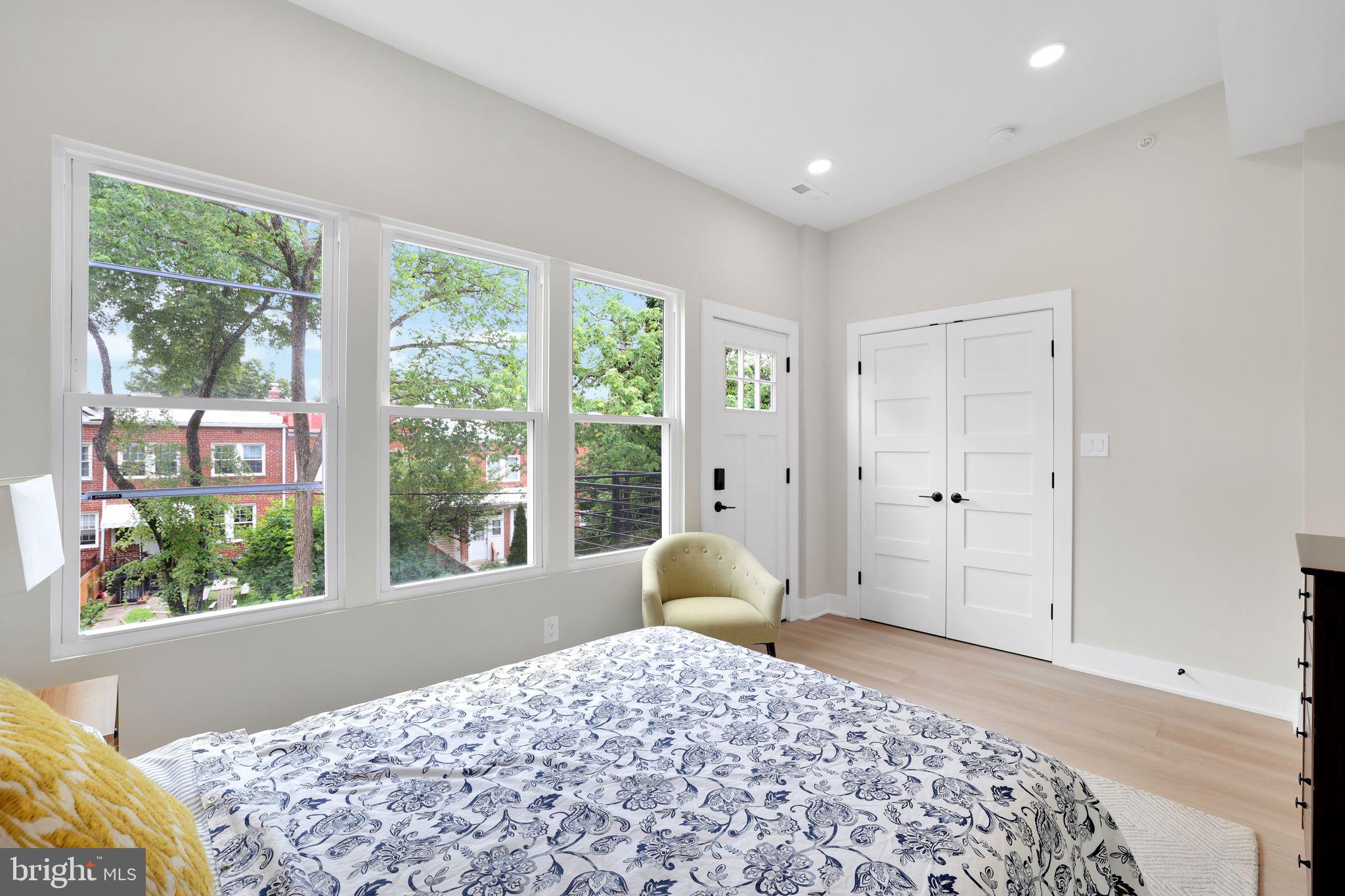 4019 9th Street Northeast, Unit 2 Washington, DC 20017 - Photo 18 of 27 a bedroom with a bed and a large window