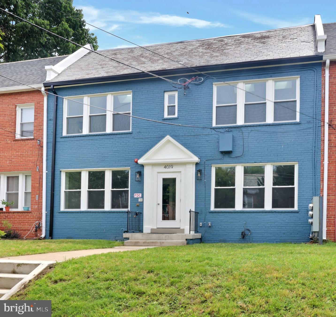 4019 9th Street Northeast, Unit 2 Washington, DC 20017 - Photo 2 of 27 a front view of a house with yard and green space