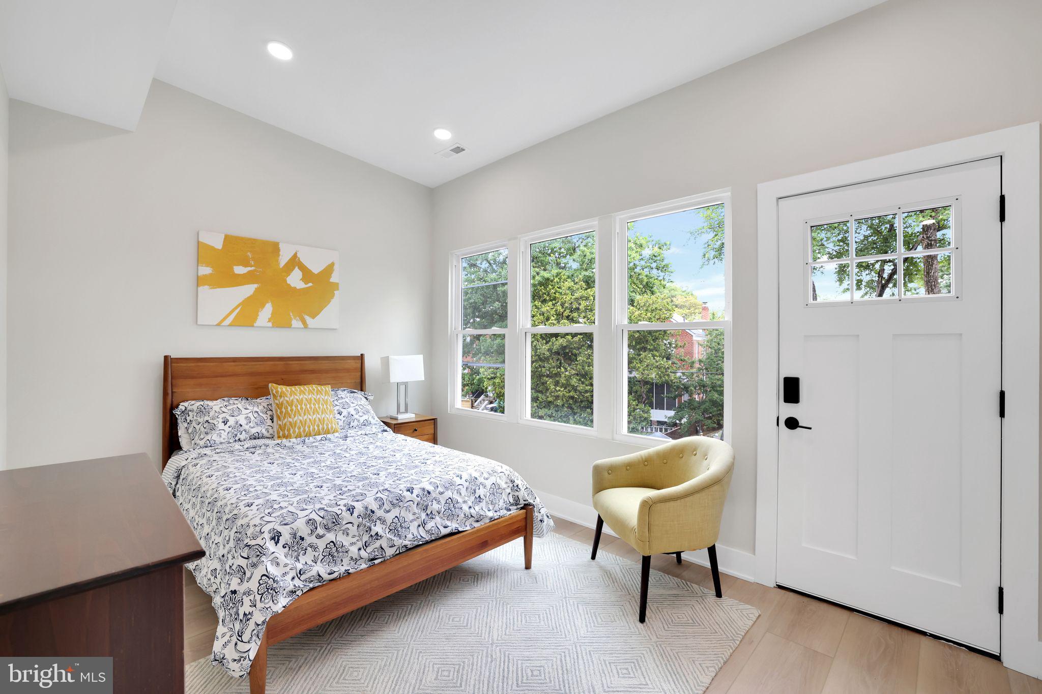 4019 9th Street Northeast, Unit 2 Washington, DC 20017 - Photo 21 of 27 a bedroom with a bed and a couch