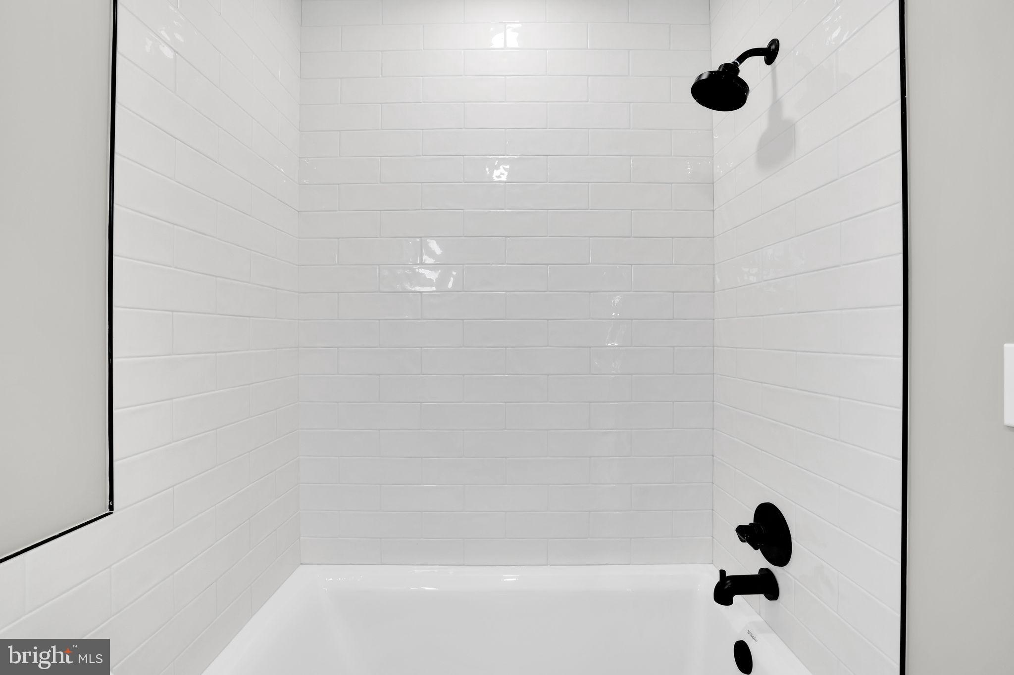 4019 9th Street Northeast, Unit 2 Washington, DC 20017 - Photo 24 of 27 a bathroom with a shower