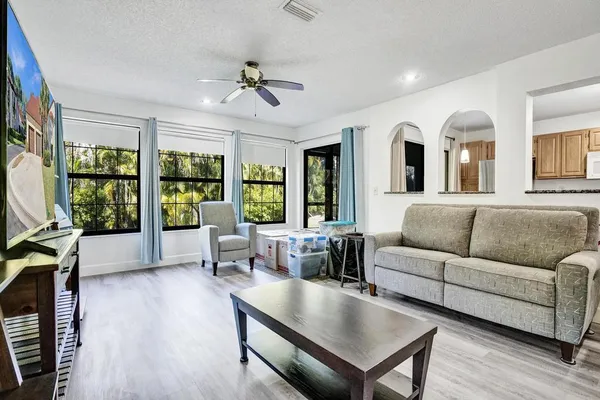 a kitchen with stainless steel appliances granite countertop a stove and cabinets