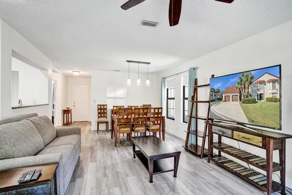 a kitchen with stainless steel appliances granite countertop a refrigerator sink and cabinets