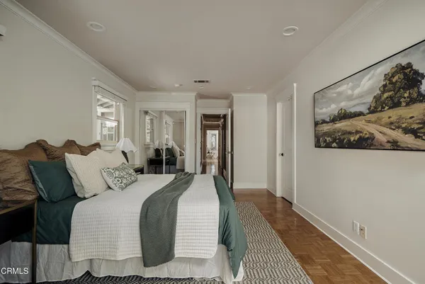 a bedroom with double bed and a window