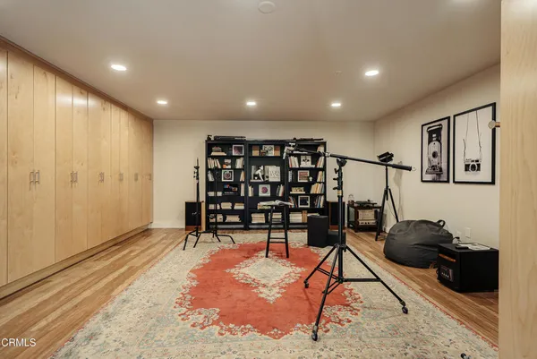 a view of a livingroom with furniture and a ceiling fan