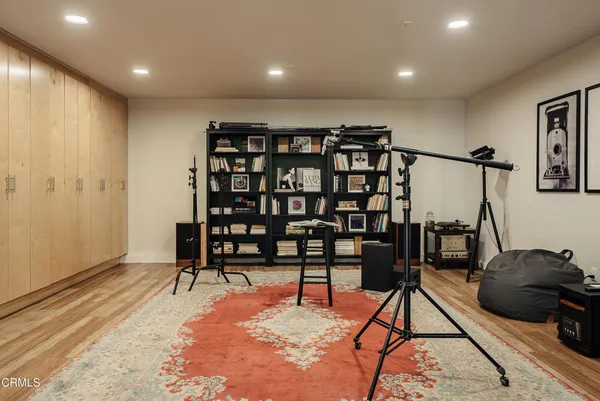 a livingroom with furniture and gym equipment