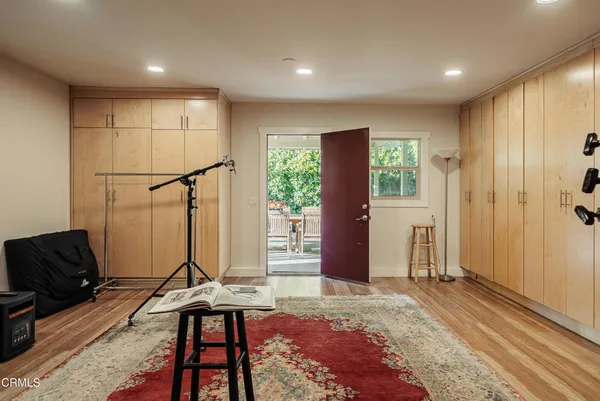 a view of an entryway with a table and chair