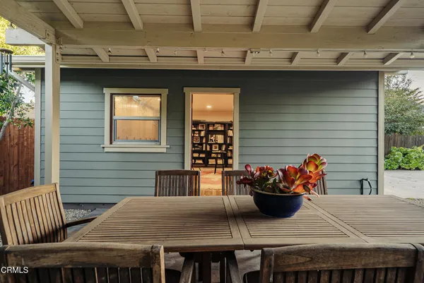 a outdoor space with dining table and chairs