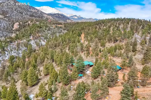 a view of a city with mountains in the background