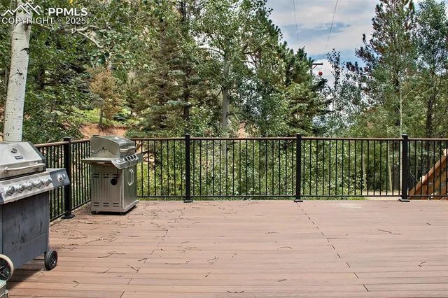 a view of a balcony with wooden floor