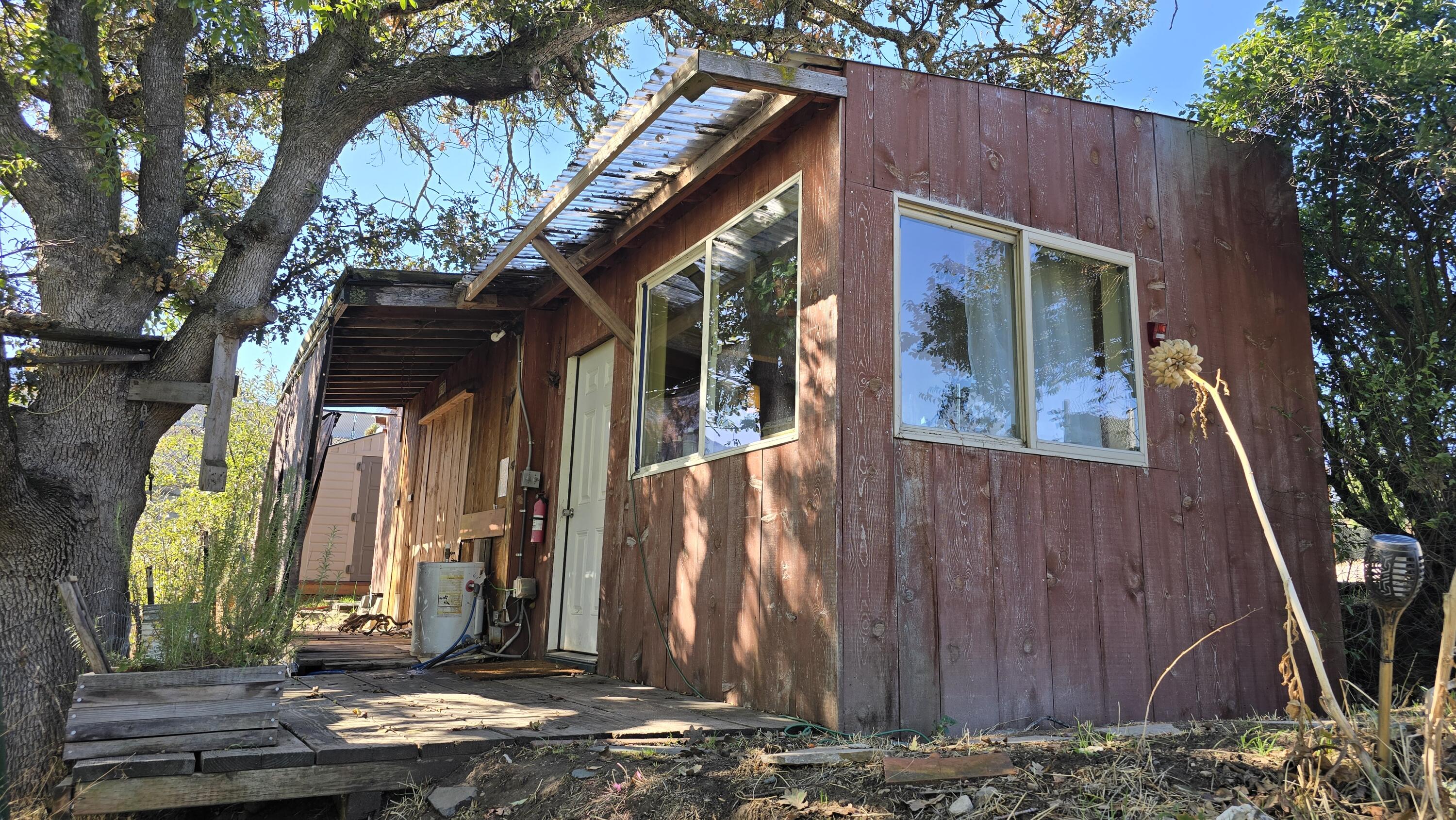 488 Crowson Road Ashland, OR 97520 - Photo 23 of 30 a view of a house with a tree