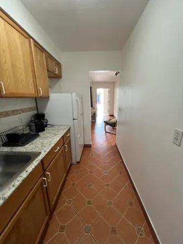 a view of a kitchen with a sink