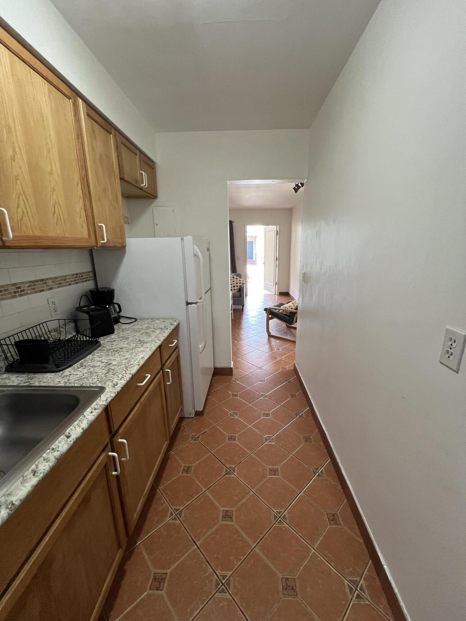 311 Inlet Way, Unit 11 Palm Beach Shores, FL 33404 - Photo 13 of 21 a view of a kitchen with a sink