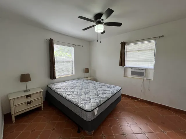 a living room with couch and a window