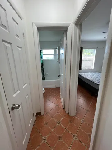 wooden floor with a bathroom