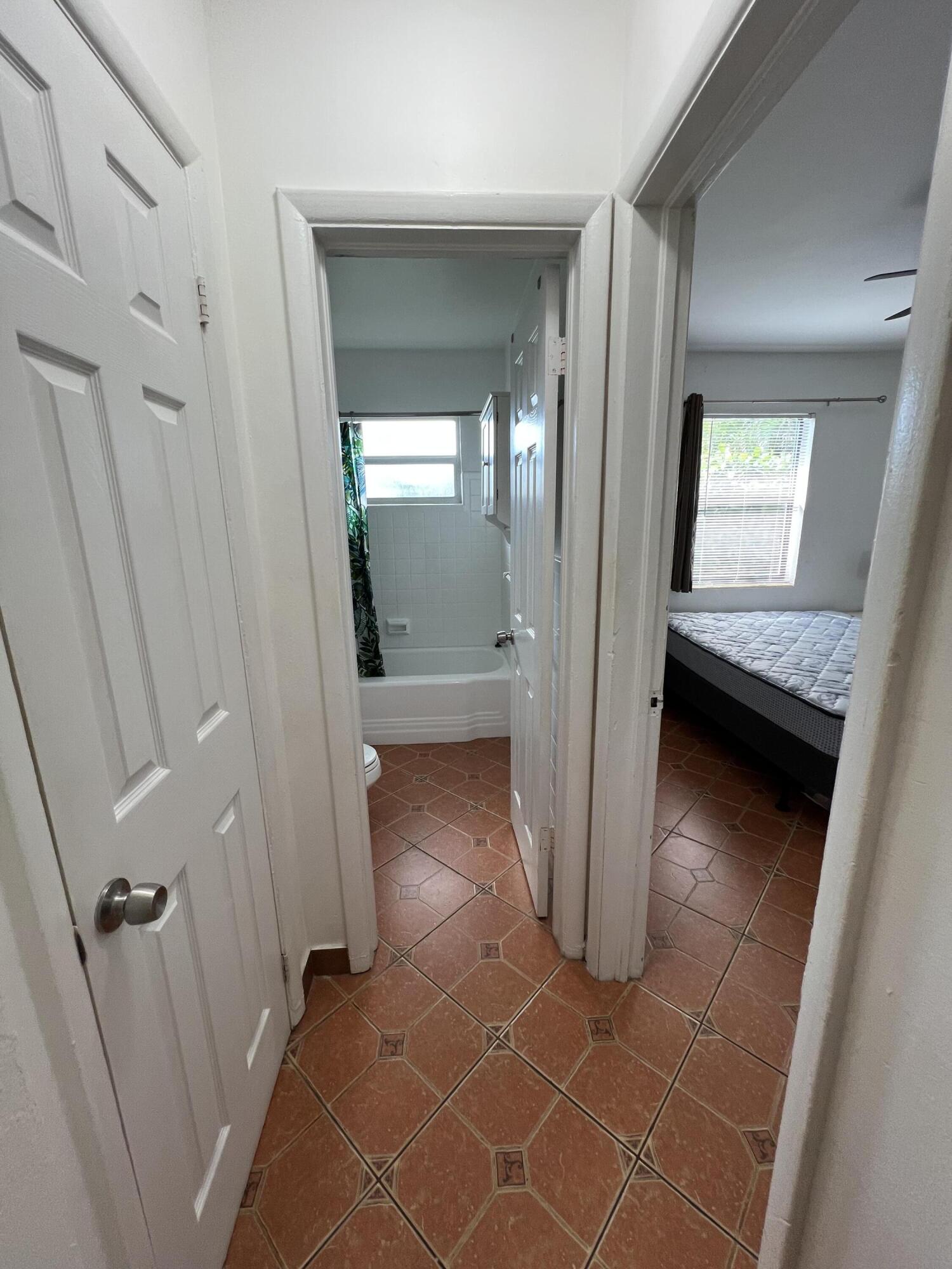 311 Inlet Way, Unit 11 Palm Beach Shores, FL 33404 - Photo 17 of 21 wooden floor with a bathroom