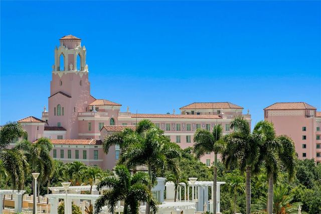 a dining hall with stainless steel appliances granite countertop a stove and a sink