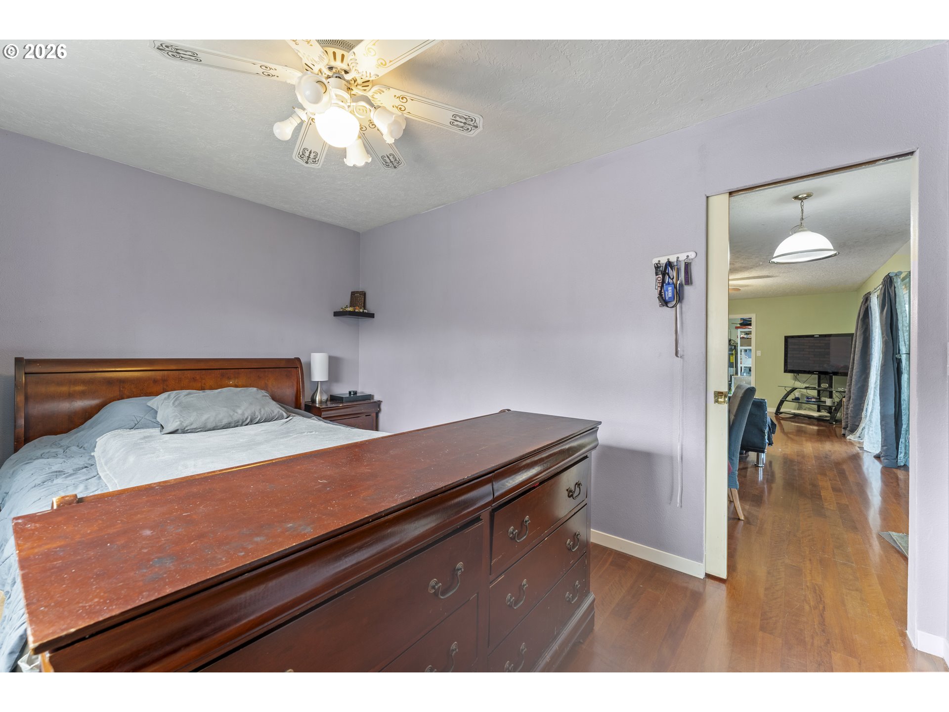 18335 Northeast Flanders Street Portland, OR 97230 - Photo 12 of 20 a view of a room that has a bed and a chandelier