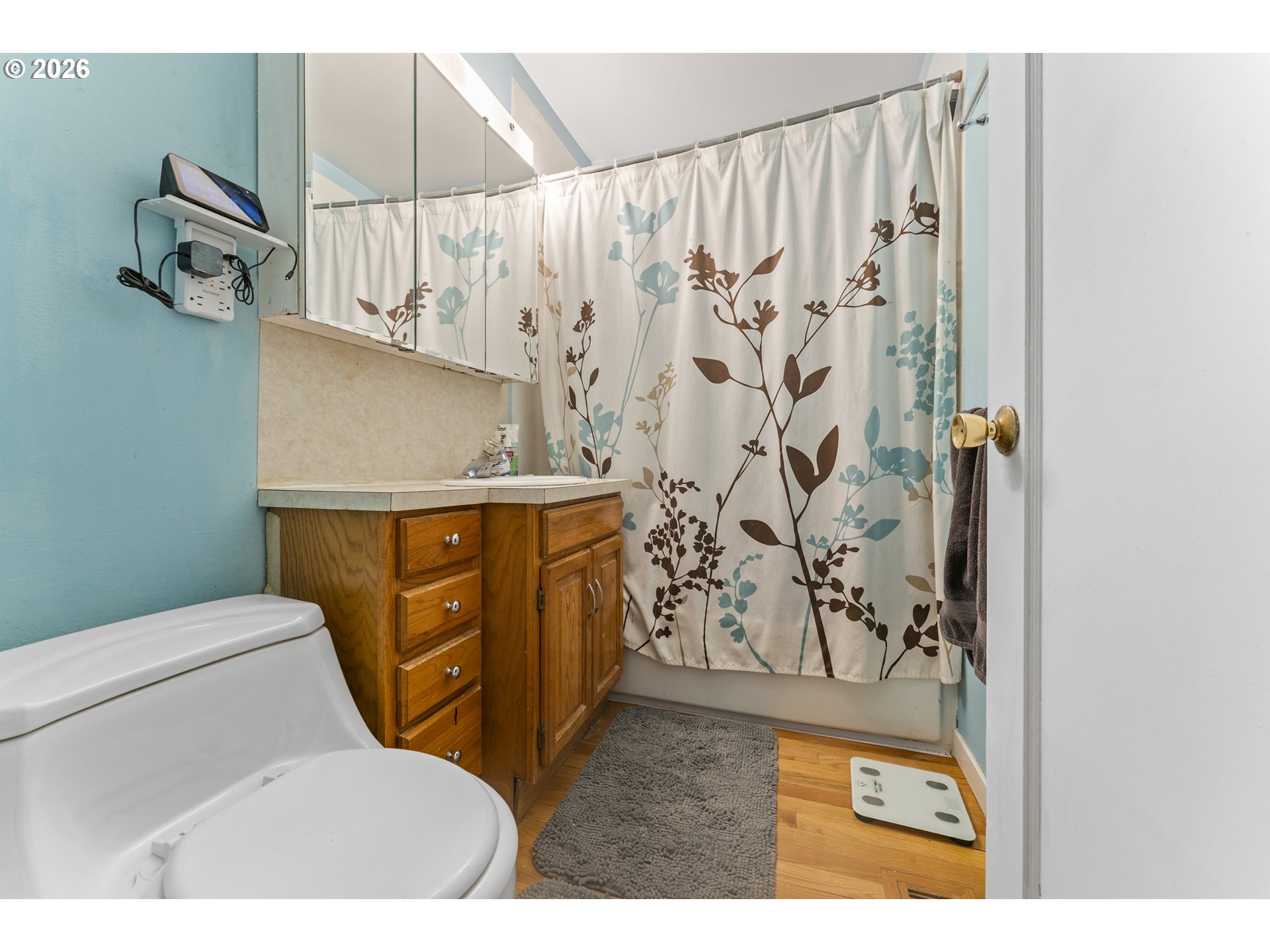 18335 Northeast Flanders Street Portland, OR 97230 - Photo 14 of 20 a bathroom with a toilet and a shower curtain