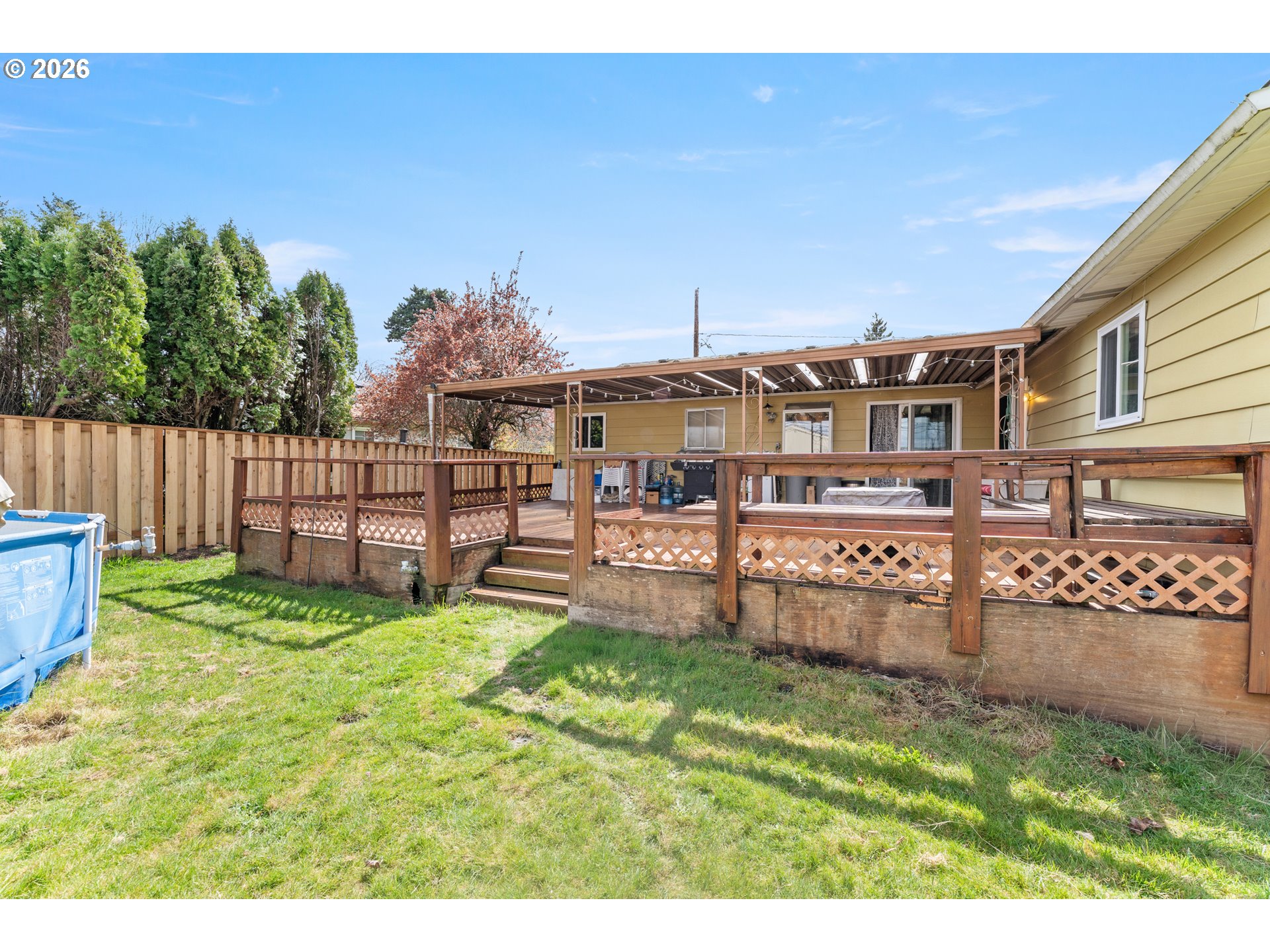 18335 Northeast Flanders Street Portland, OR 97230 - Photo 17 of 20 a view of a backyard with a garden and deck