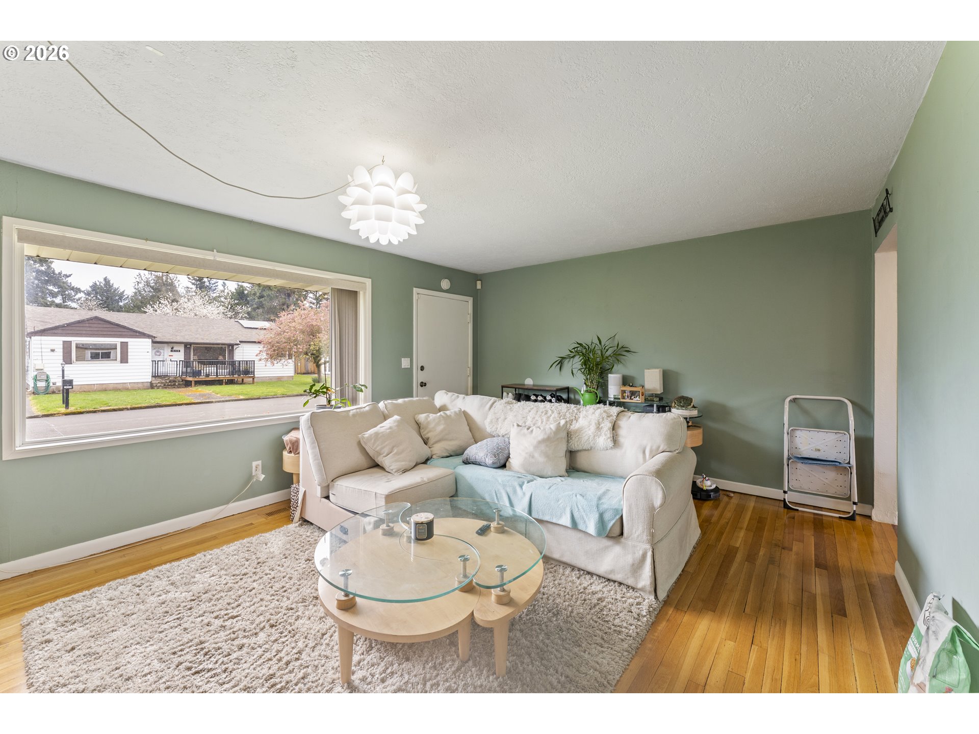 18335 Northeast Flanders Street Portland, OR 97230 - Photo 2 of 20 a living room with furniture and a large window
