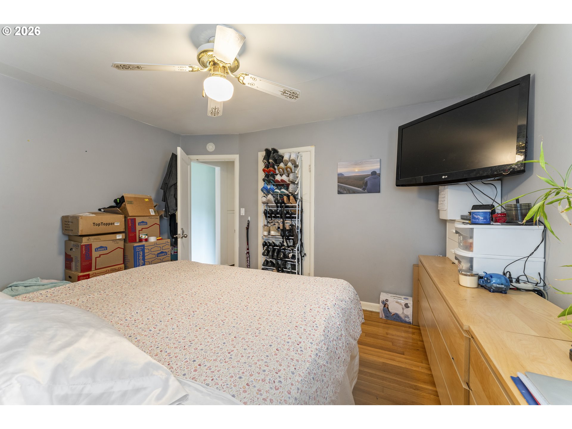 18335 Northeast Flanders Street Portland, OR 97230 - Photo 8 of 20 a bedroom with a bed and a flat screen tv