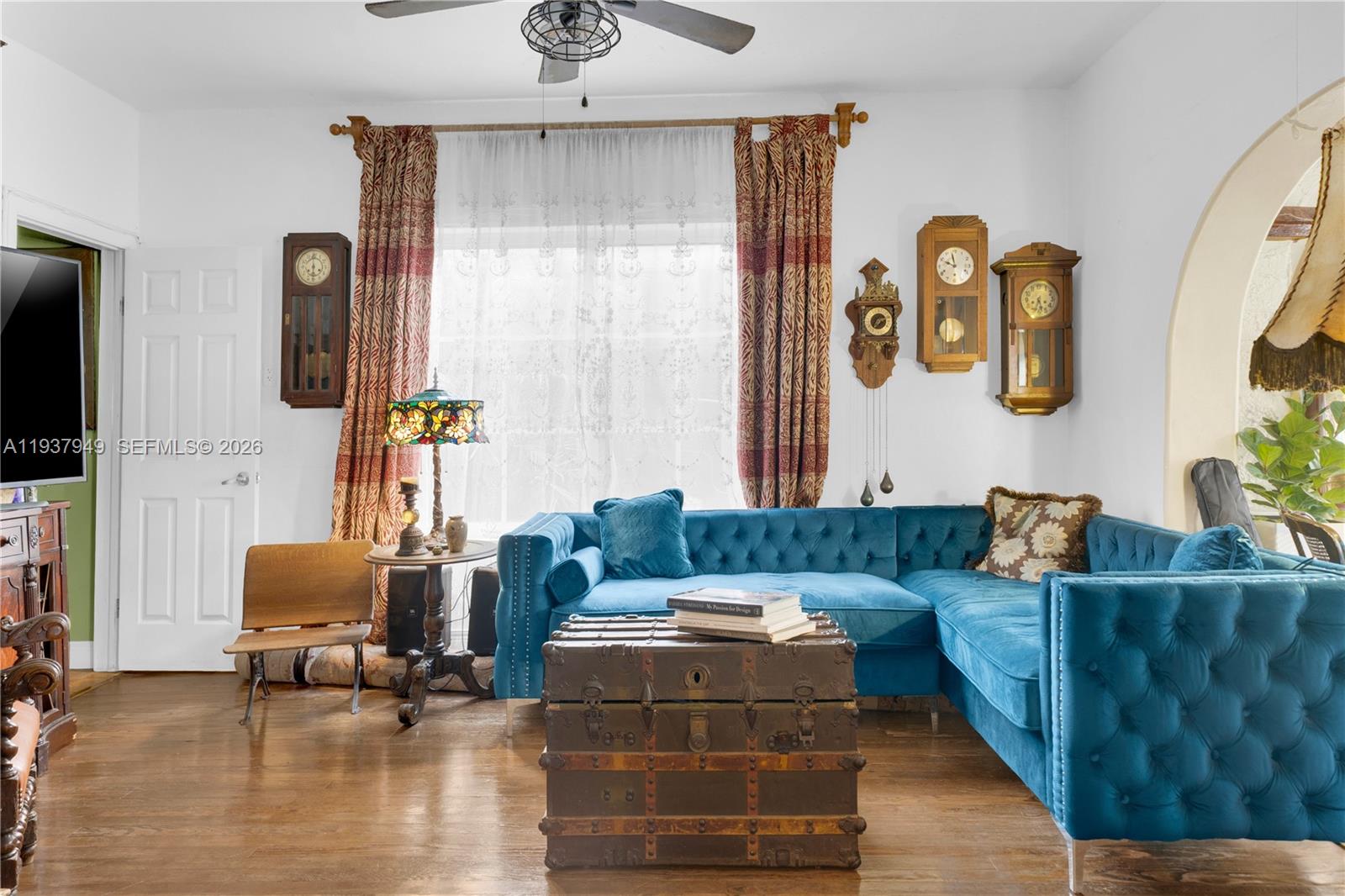 4739 Southwest 5th Street Miami, FL 33134 - Photo 24 of 40 a living room with furniture and a flat screen tv