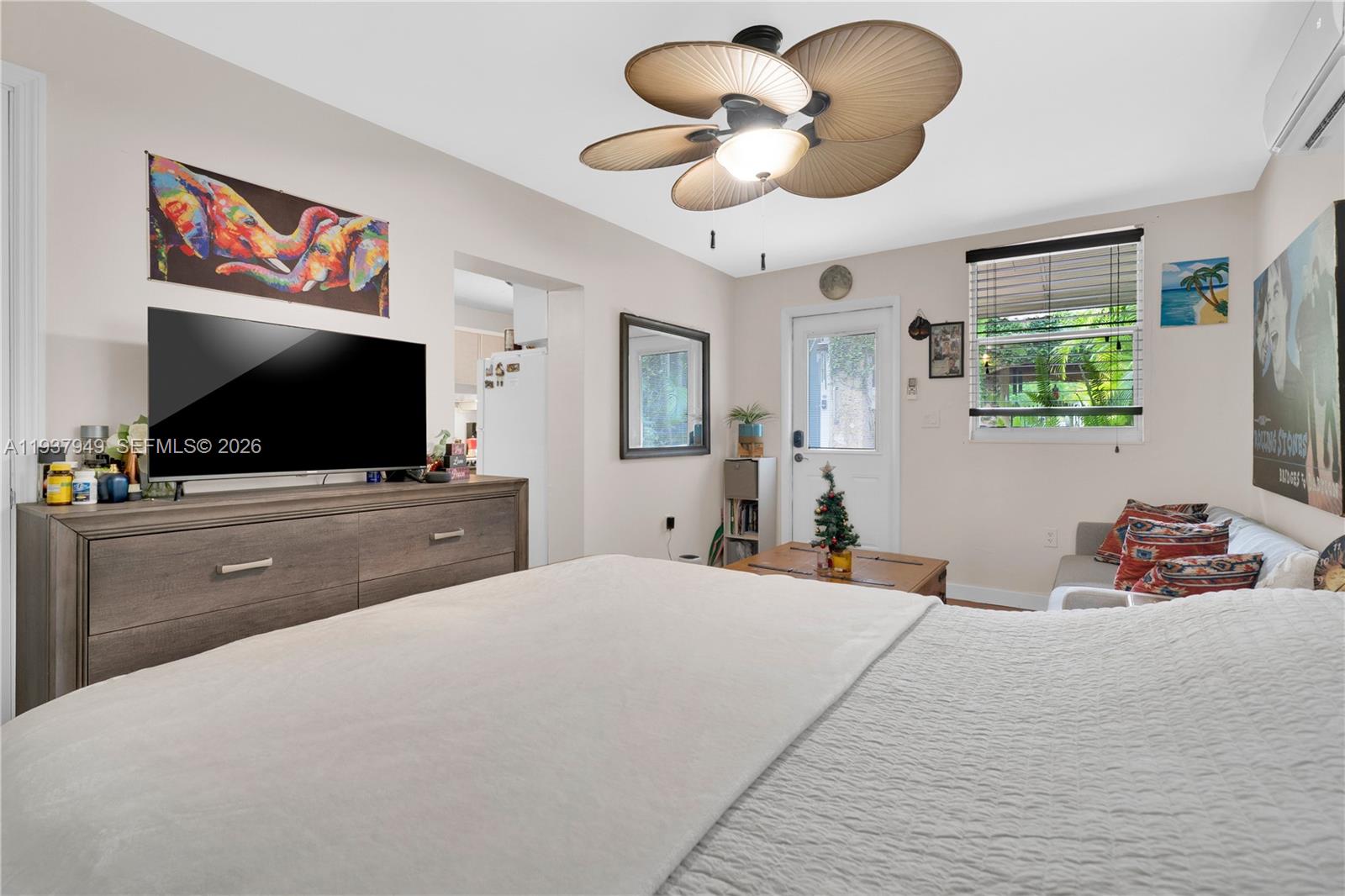 4739 Southwest 5th Street Miami, FL 33134 - Photo 33 of 40 a bedroom with a large bed and a flat screen tv