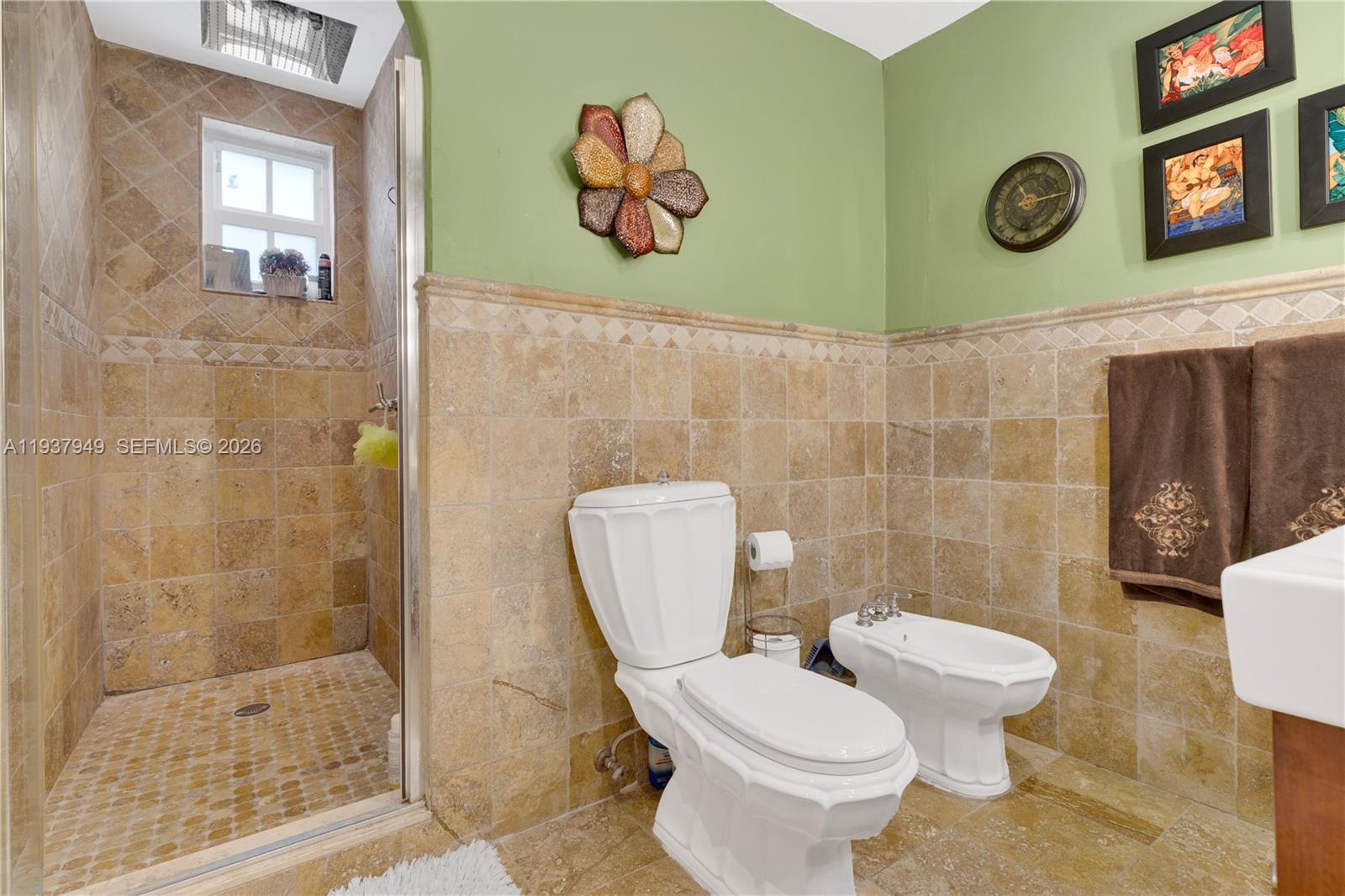 4739 Southwest 5th Street Miami, FL 33134 - Photo 39 of 40 a white toilet sitting next to a bathroom sink