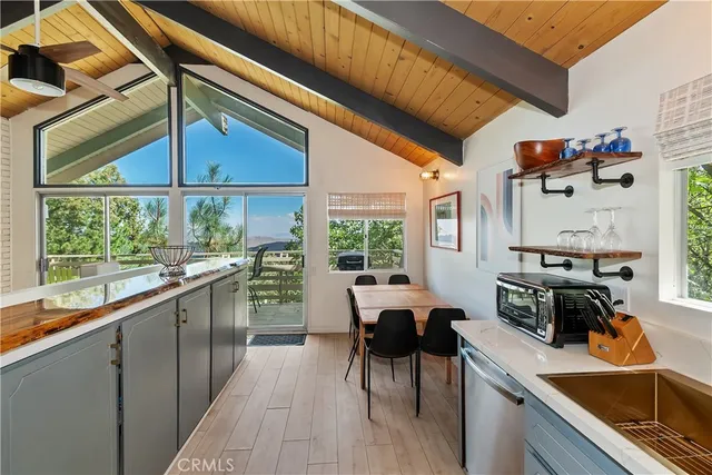a kitchen with stainless steel appliances granite countertop sink stove and cabinets