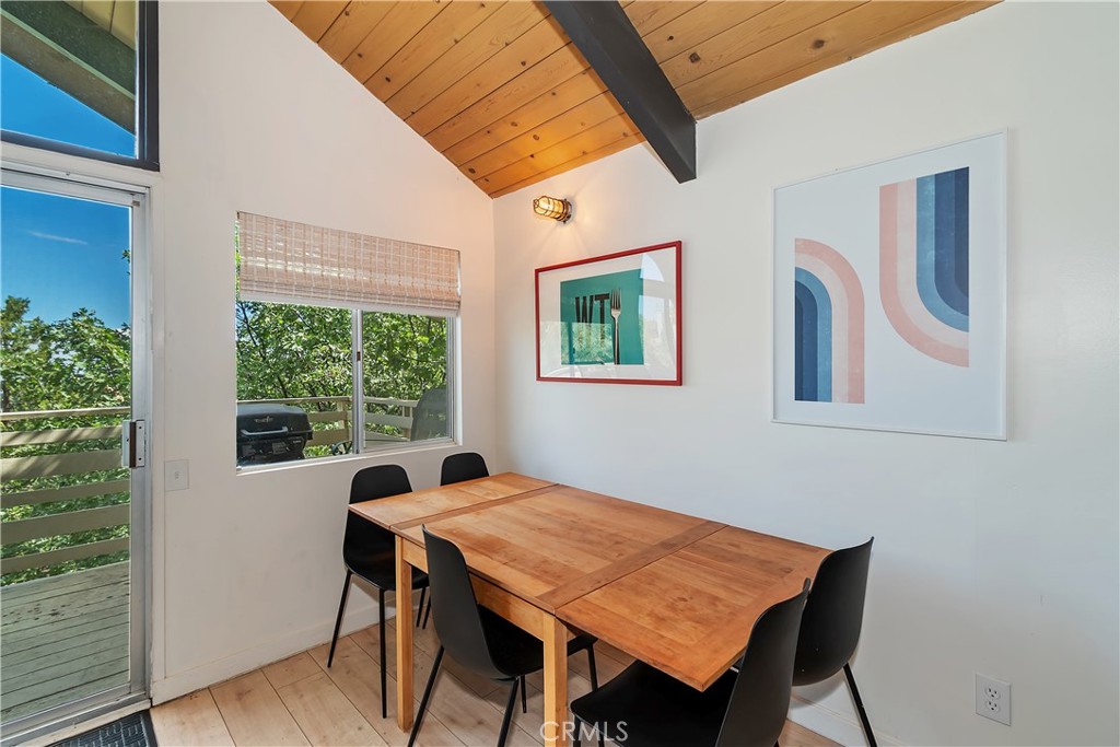 1219 Klondike Drive Lake Arrowhead, CA 92352 - Photo 11 of 37 a view of a dining room with furniture window and wooden floor