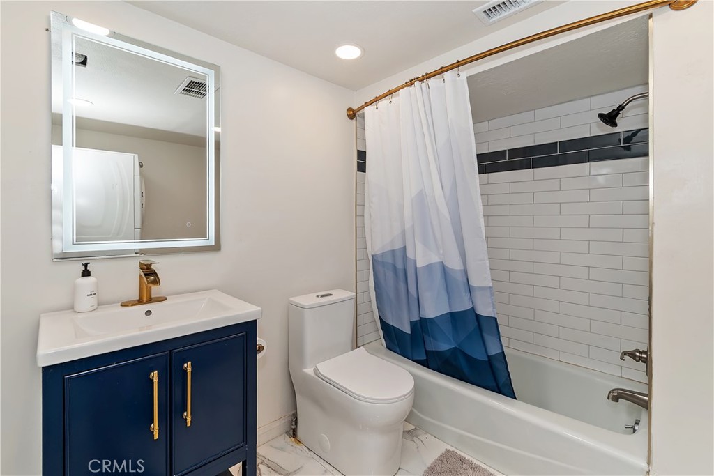 1219 Klondike Drive Lake Arrowhead, CA 92352 - Photo 18 of 37 a bathroom with a sink a toilet and shower