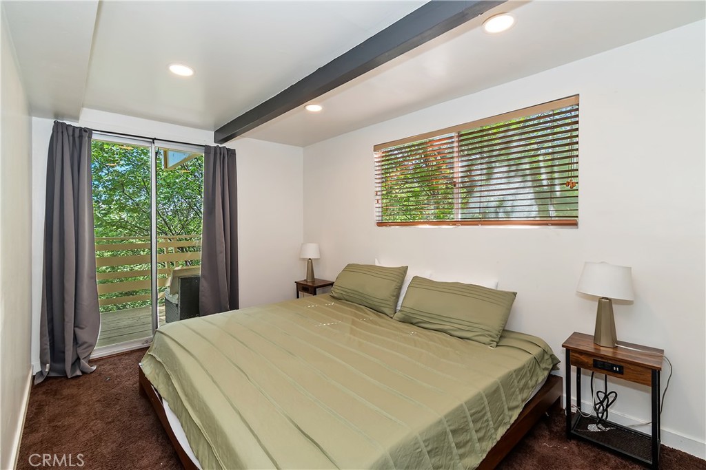 1219 Klondike Drive Lake Arrowhead, CA 92352 - Photo 19 of 37 a bedroom with a bed and a tv