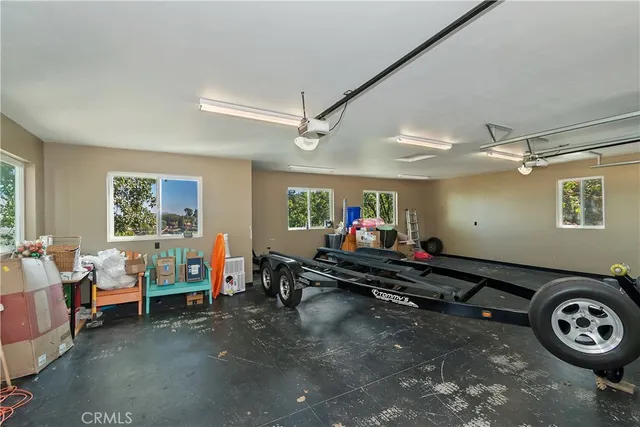 a view of a house with a yard and garage