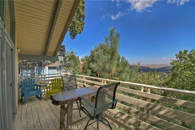 a view of a balcony with furniture