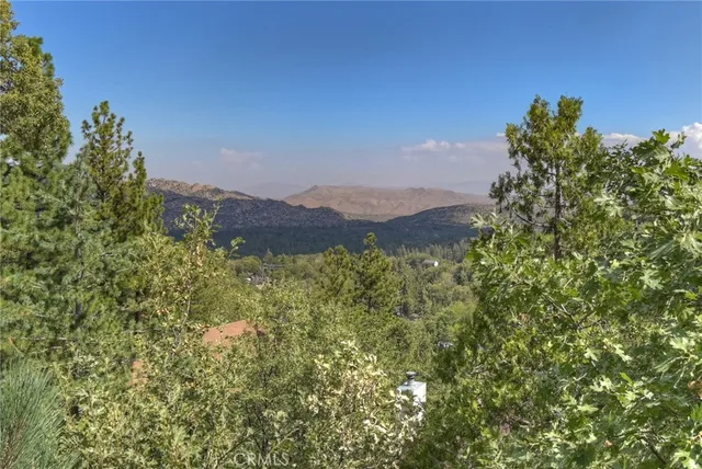 a balcony with wooden floor and furniture