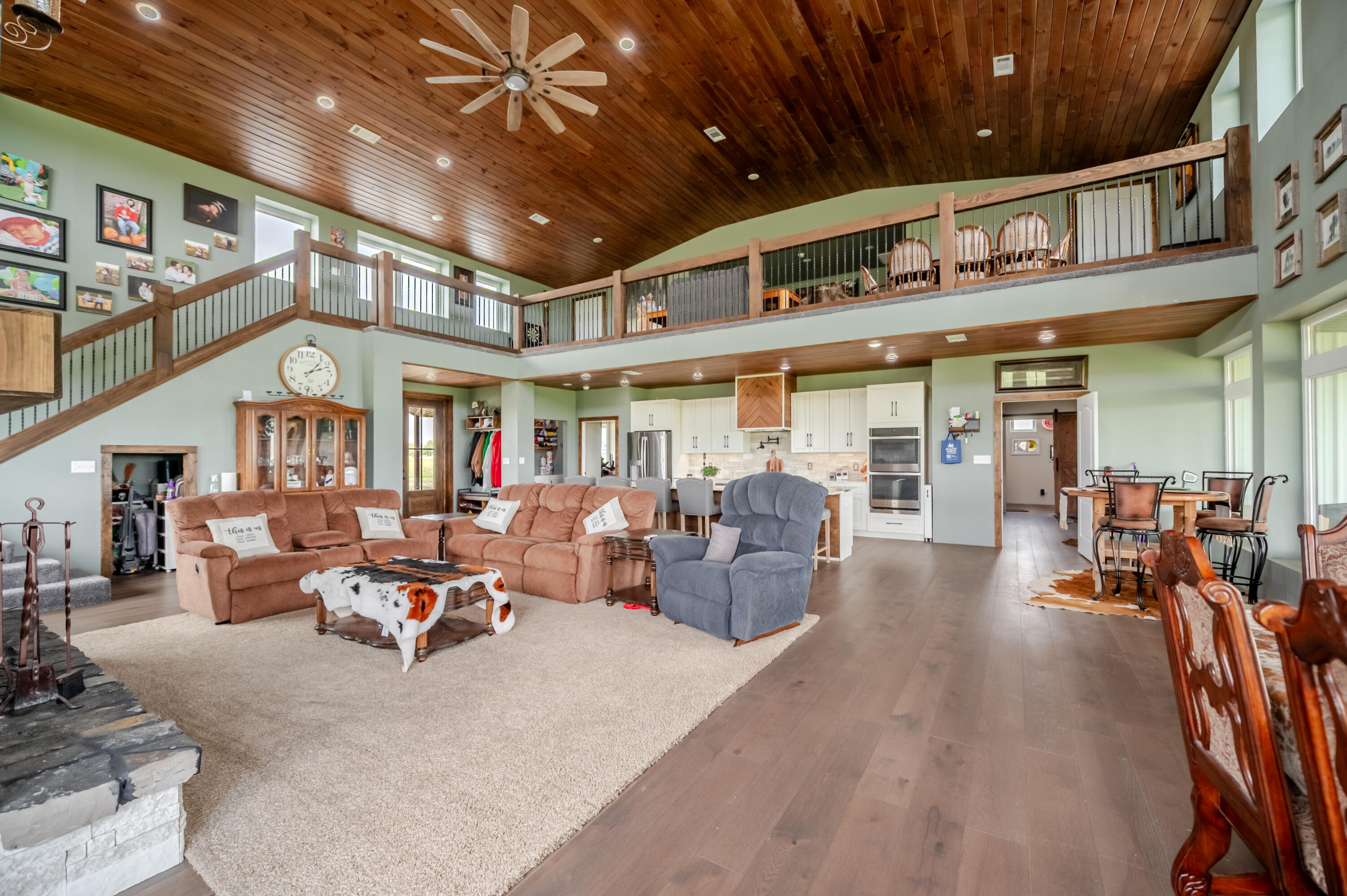 6792 Maine Road Anton, TX 79313 - Photo 37 of 77 a living room with lots of furniture and a chandelier