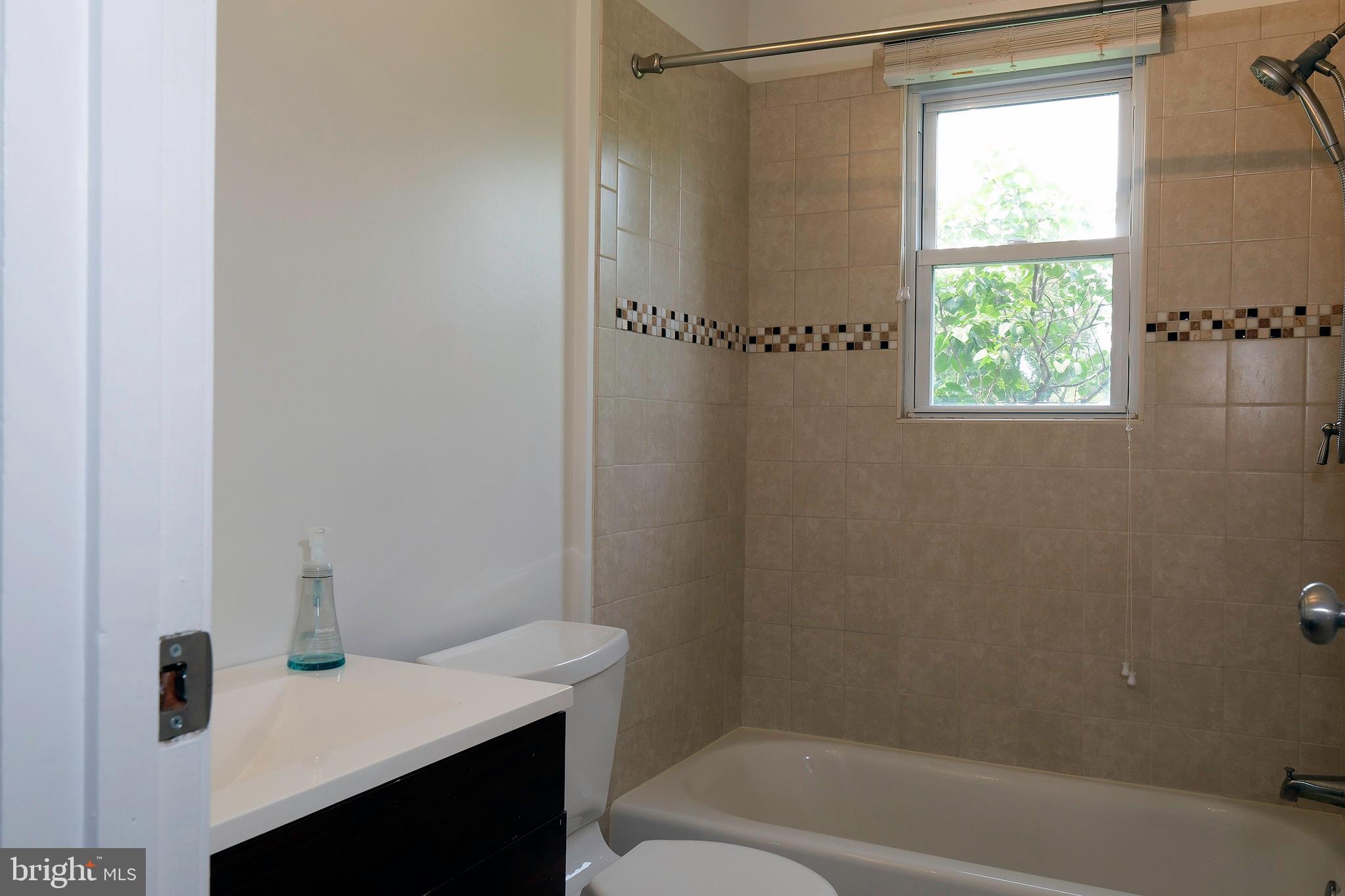 12720 Feldon Street Silver Spring, MD 20906 - Photo 10 of 13 a bathroom with a sink and a bathtub