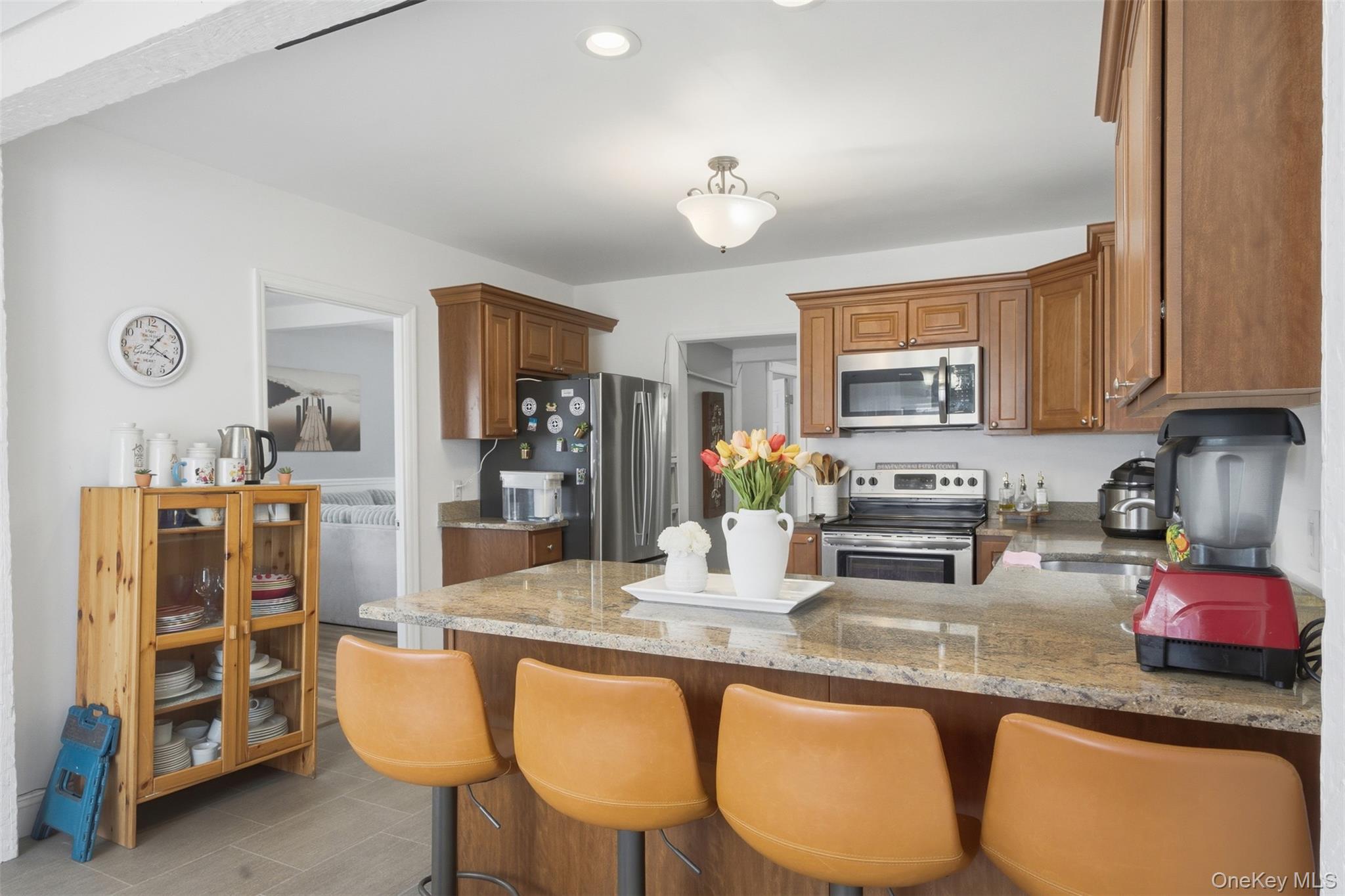 64 Wait Street Walden, NY 12586 - Photo 13 of 26 a kitchen with granite countertop a sink cabinets and appliances