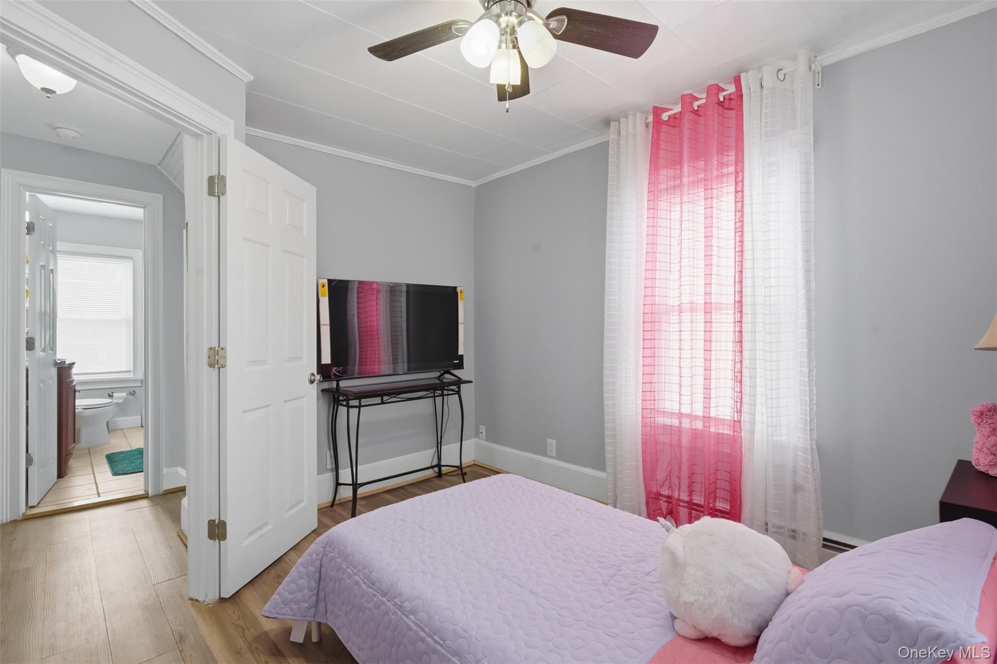 64 Wait Street Walden, NY 12586 - Photo 23 of 26 a bedroom with a bed and a flat screen tv