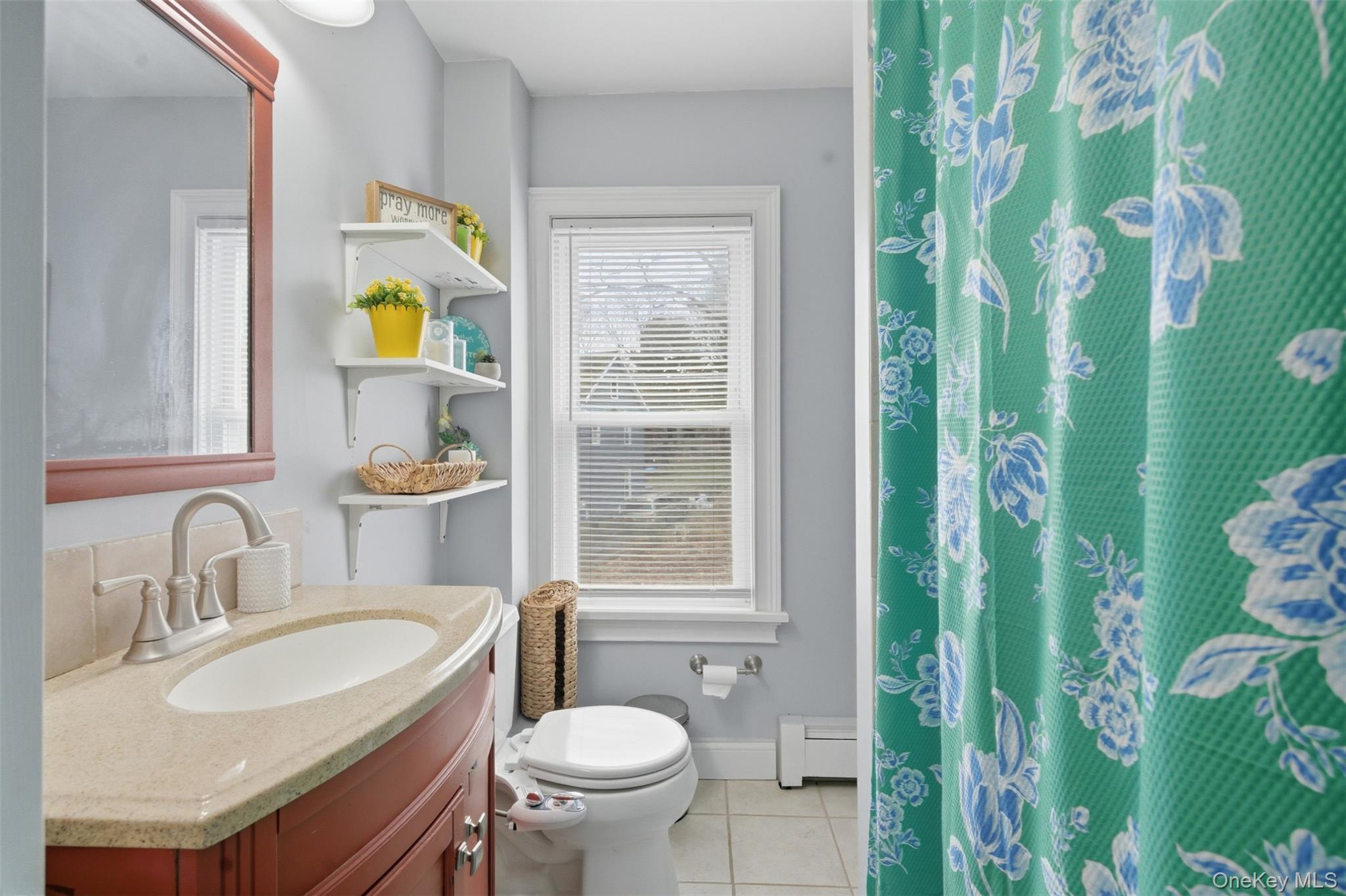 64 Wait Street Walden, NY 12586 - Photo 24 of 26 a bathroom with a granite countertop toilet sink and mirror
